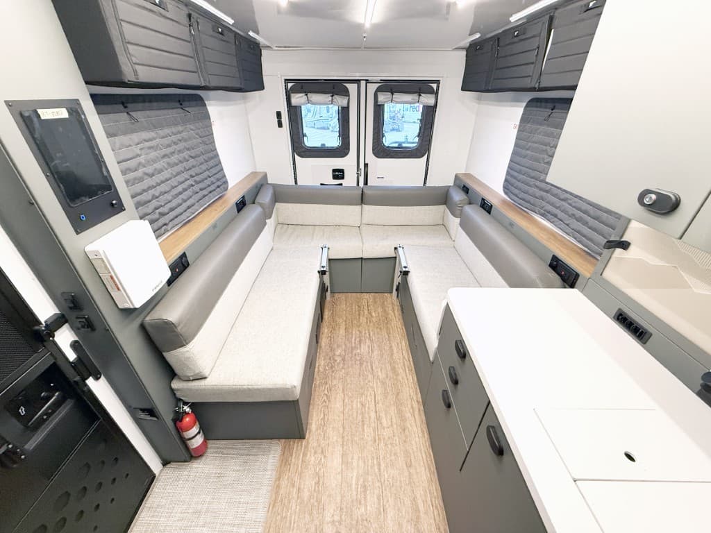 Convertible dinette and living area inside the 2027 Winnebago ARKA 20Z.