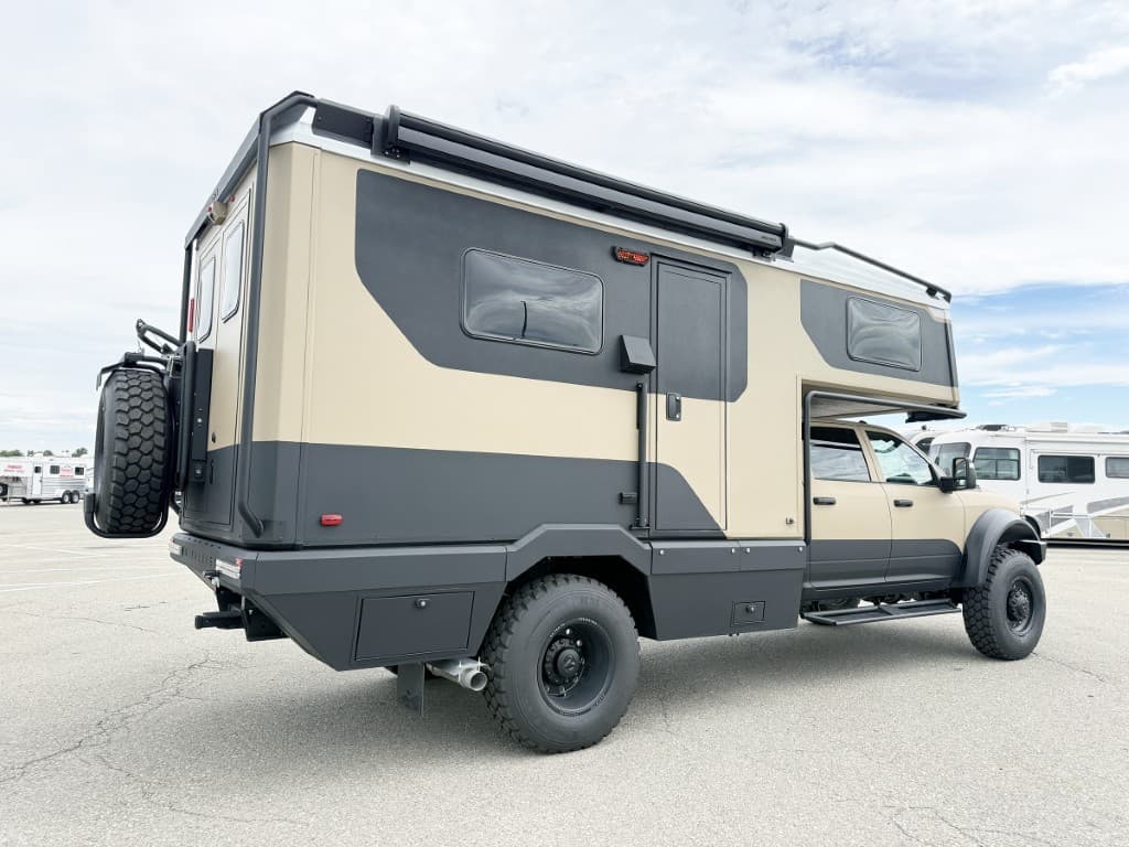 Rear three-quarter view of the 2027 Winnebago ARKA 20Z with spare tire.