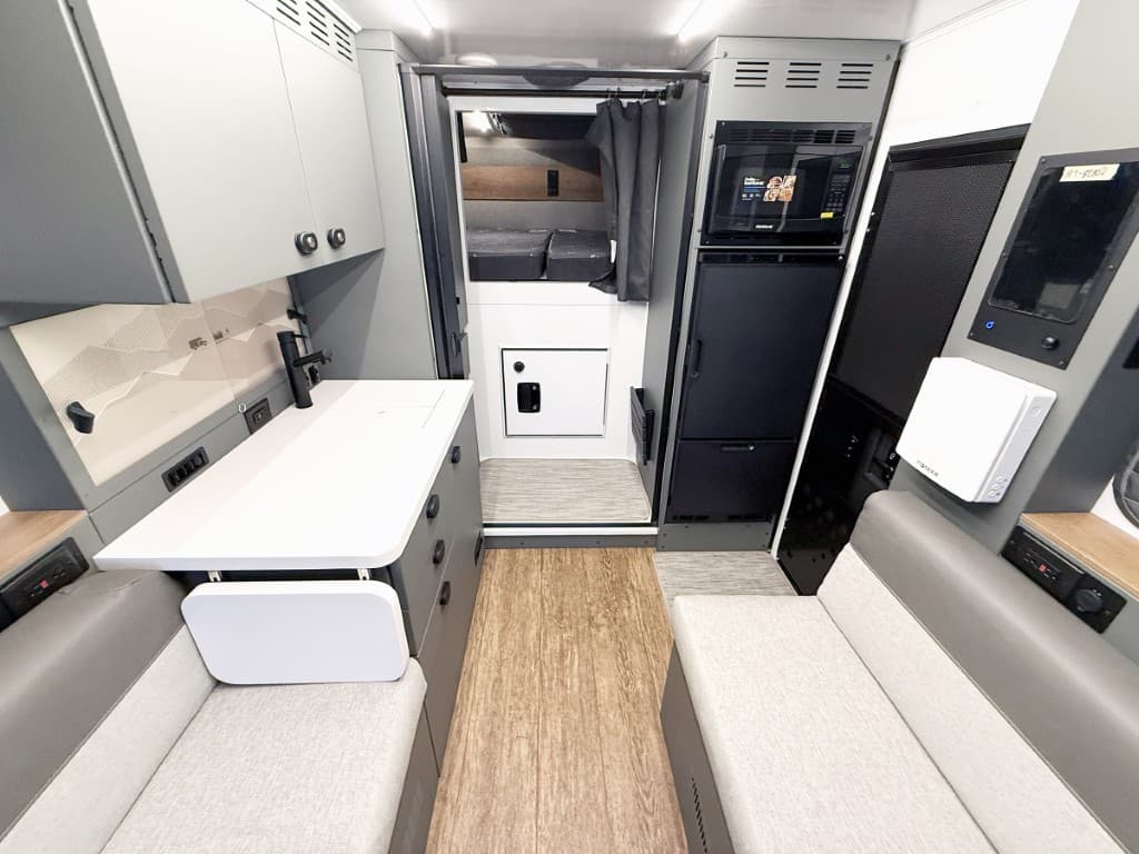 Galley, refrigerator, and wet bath inside the 2027 Winnebago ARKA 20Z.