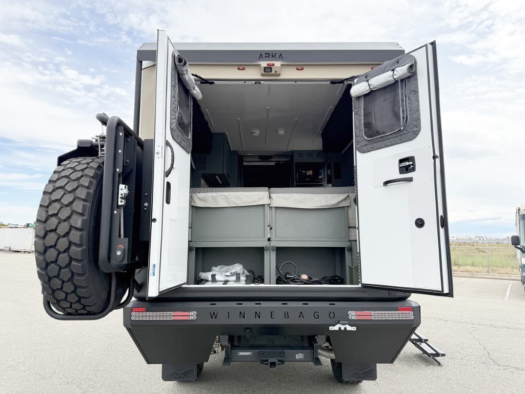 Open rear doors showing the gear garage and sleeping area of the 2027 Winnebago ARKA 20Z.