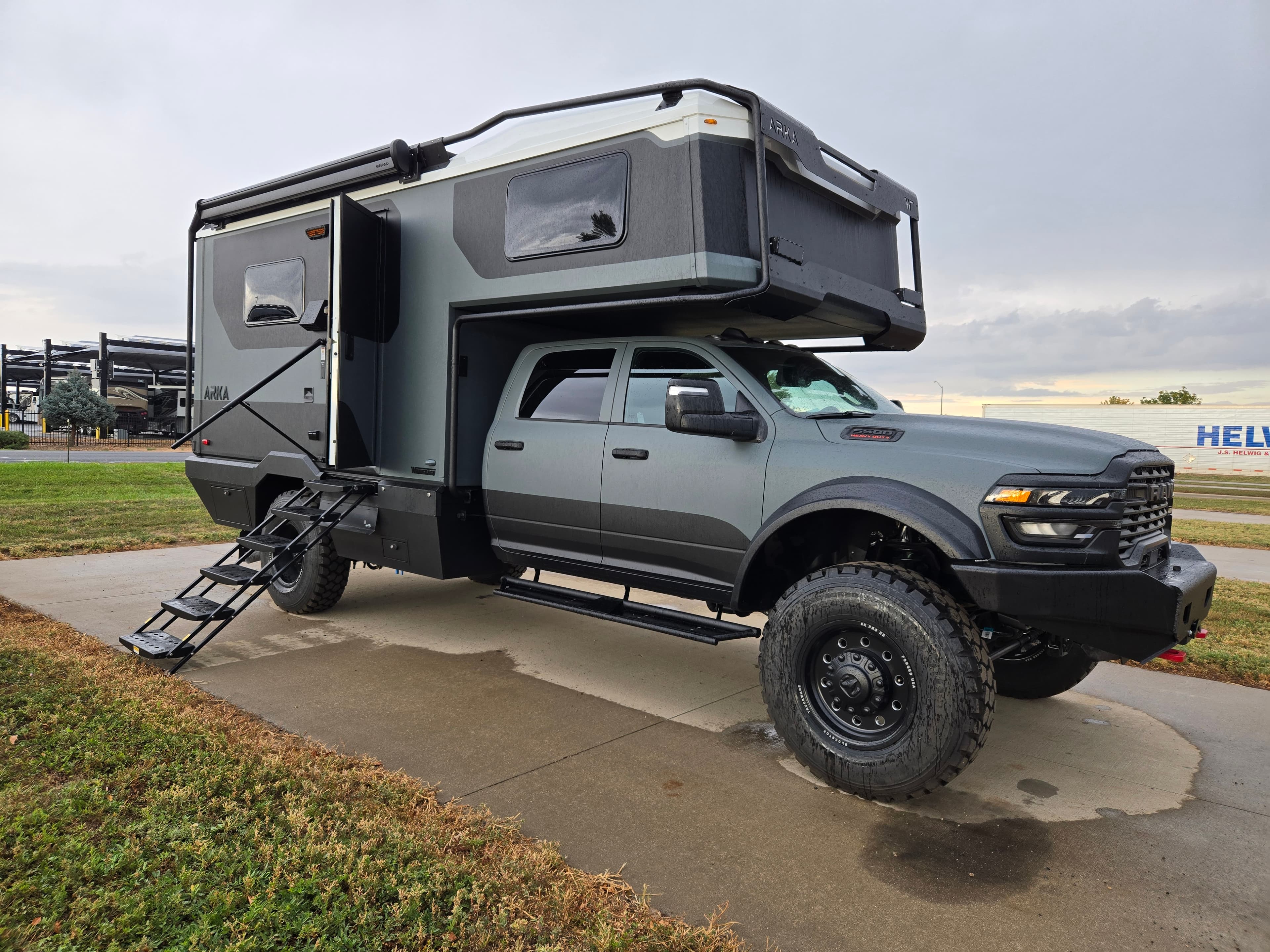 2027 Winnebago ARKA 20Z with the entry door open and stairs down.